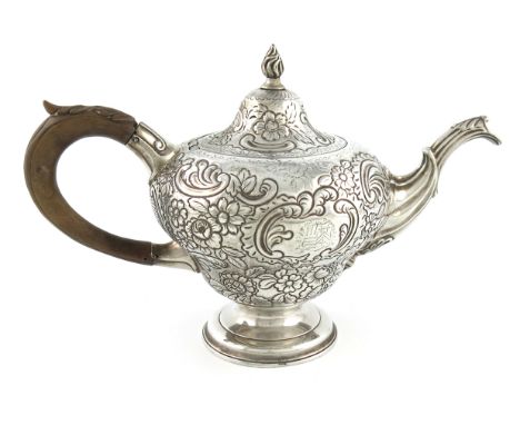 A George III Scottish silver tea pot, by Lothian and Robertson,  Edinburgh 1763, inverted pear form, chased foliate scroll de