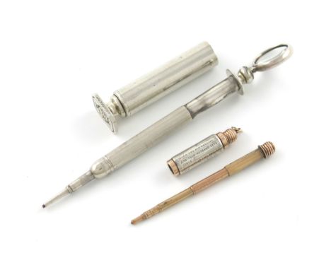 A novelty silver and gold pencil, by J. Vickery, modelled as a rolling pin, with a chain attachment, inscribed 'When you are 