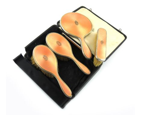 A five-piece silver and enamel dressing table set, by Asprey and Co Ltd, London 1937, comprising: a hand mirror, three brushe