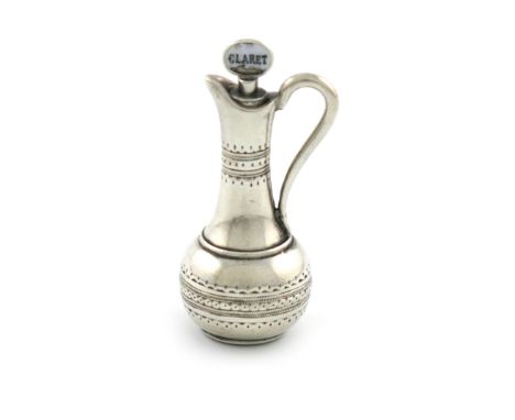 A Victorian novelty silver pencil, unmarked, modelled claret jug, with a stopper enamelled 'CLARET', length 4.3cm. Provenance