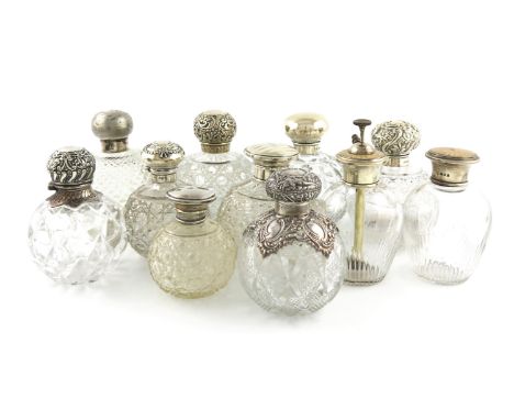 A collection of eleven mounted scent bottles, various dates and makers, comprising: two with enamel decoration, and one of wh