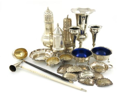 A mixed lot of silver items, various dates and makers, comprising: a pair of vases, Sheffield 1909, a sugar caster of octagon