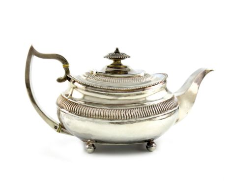 λA George III silver tea pot, by Solomon Hougham, London 1816, oblong bellied form, part-fluted decoration, the scroll handle