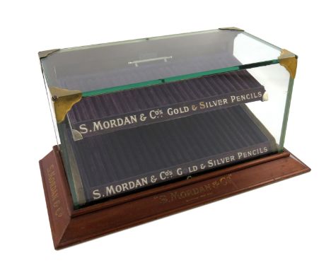 A S. Mordan and Co. display case, rectangular glass body, on a raised tapering wooden rectangular foot, with 'S. Mordan and C