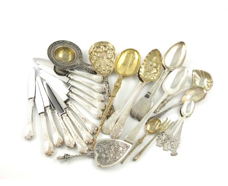 A mixed lot of silver flatware, comprising: a silver-gilt anointing spoon, two berry spoons, three tablespoons, a fruit servi