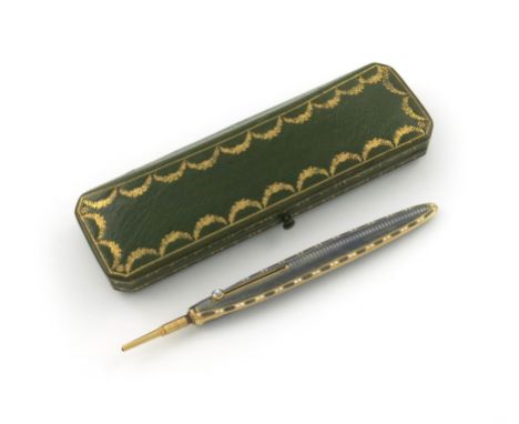 A French gold and enamel pencil, by Cartier, Paris, feather quill form, with grey enamel decoration and a gold and white enam