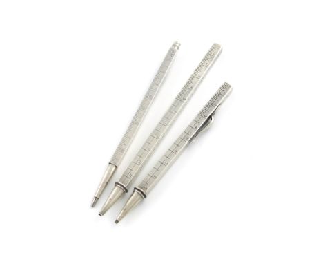 A small collection of three novelty silver pencils, modelled as rulers, one engraved 'Sept. 27th', one engraved 'To my husban