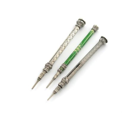 A small collection of four Victorian silver Everpointed pencils, various designs, including one with a green enamel body with