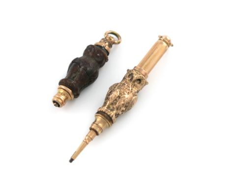 A Victorian novelty gilt-metal and resin pencil, marked Pat. March 21 71, modelled as a standing owl, set with red eyes and a