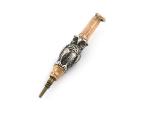 A Victorian novelty silver and gilt-metal pencil, unmarked, modelled as a standing owl, set with red eyes and a ring attachme