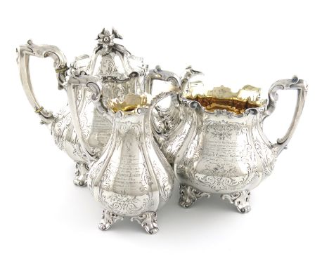 λA three-piece Victorian silver presentation tea set, by James &amp; Nathaniel Creswick, London 1854, lobed baluster form, le