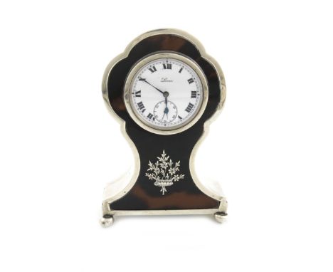 λA silver and tortoiseshell mantle clock, over-stamped with maker's mark of Mappin and Webb, Birmingham 1920, shaped oval for