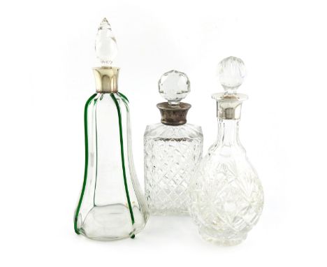 An Edwardian silver-mounted glass decanter, by John Grinsell, Birmingham 1905, slender shaped circular form, with green glass
