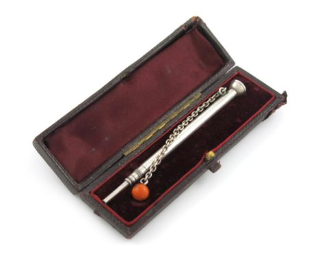 λA Victorian novelty pencil, by S. Mordan and Co. modelled as a cup and ball, the coral ball with a chain, in a case, length 