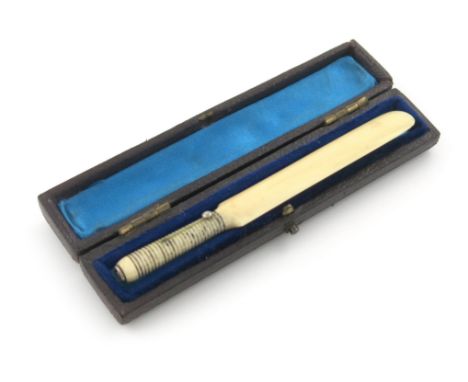 λA Victorian novelty ivory pencil, unmarked, modelled as a cricket bat, in a case, length 9.3cm. Provenance: The KB Collectio