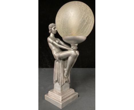 An Art Deco style table lamp, moulded as a semi-clad female nude, seated with globe, crackle glass shade, Widdop Bingham &amp