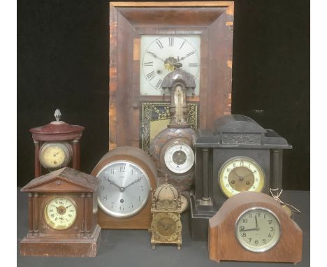 A 19th century Belge noir architectural mantel clock, 31.5cm high; a 1930's oak dome topped mantel clock; other early 20th ce