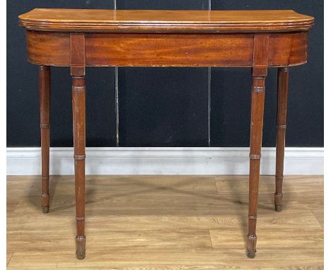 A 19th century mahogany tea table, hinged top, ring-turned legs, 74cm high, 91.5cm wide, 45cm deep 