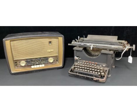 A Murphy bakelite valve radio, mid 20th century; a Remington Standard typewriter (2) 