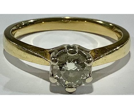 Ladies 18ct Gold Ring set with a solitaire diamond. Round brilliant cut diamond approx 0.60ct, claw set in white gold, size O