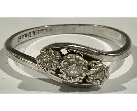 A three stone diamond ring, set in platinum white gold shank, 2.2g 