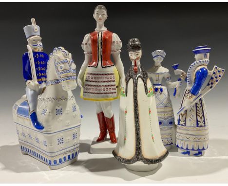 A Hungarian Hollohaza figure, soldier on horseback, 27.5cm; another, post-hunting group, 21cm; a Hollohaza figure, girl in tr