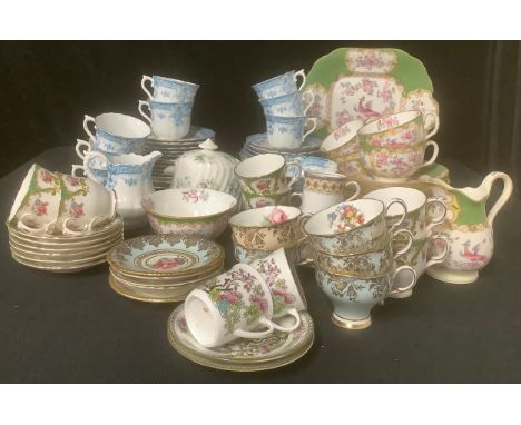 A Mintons part tea service, comprising cake plate, side plates, cups and saucers, etc; an Edwardian Court China tea service f