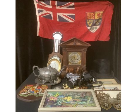 A late Victorian oak architectural mantel clock, 40cm high, lacking hands; a carved oak barometer; a moleskin top hat; painte