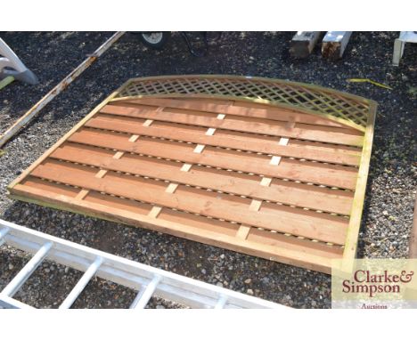 One arched fence panel and two trellis panels