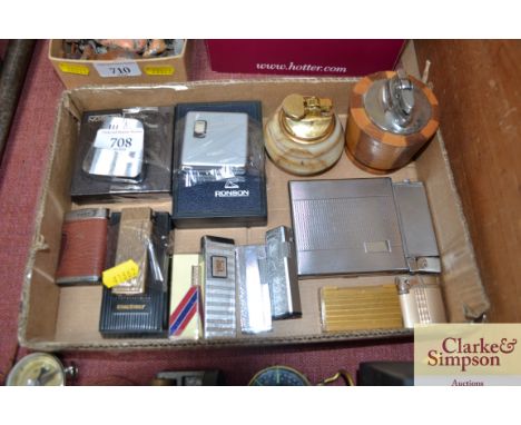 A box of various vintage lighters etc