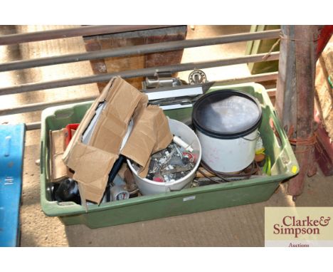 A plastic box containing a set of modern lights, extractor fan, screws and bolts, tools etc.