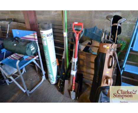 A quantity of long handled and other garden tools 