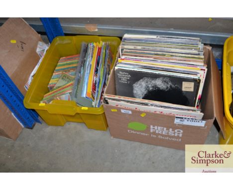 Two boxes containing various records and books to include vintage Ladybird books