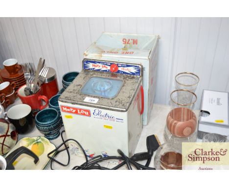 A vintage toy washing machine with original box
