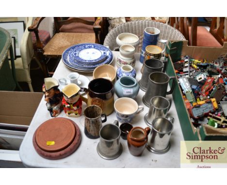 A quantity of silver plated and pewter tankards; Long John Silver jug; chamber stick; blue and white china etc