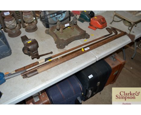 A Taylors hand forged putter; a Roberts putter and an ice axe 