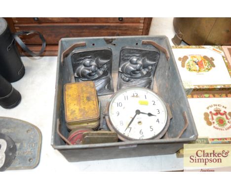 A quantity of vintage tins; an old clock and a metal storage box; pewter book ends etc.