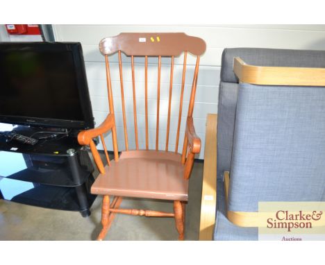 A stick back rocking chair