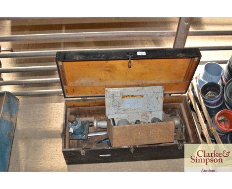 A box containing air tools, Stilsons etc