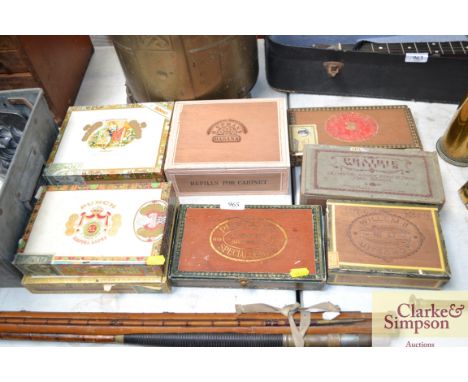 A box of vintage cigar boxes and some cigars