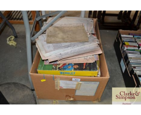 A box of various vintage games together with a quantity of unframed maps