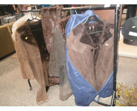 rail of vintage sheepskin coats and a shawl, rail no inc.