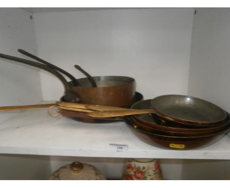 shelf of brass & copper pans