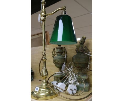 A brass student's lamp and two onyx lamps