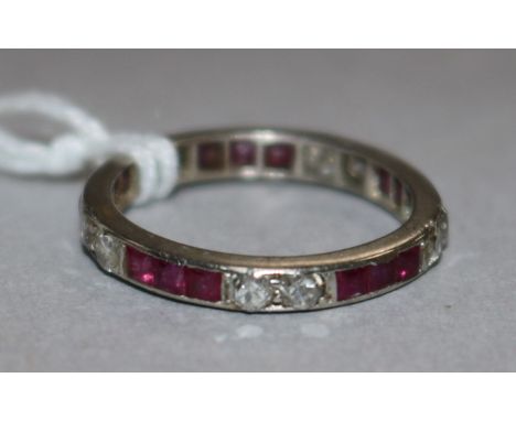 A white metal ruby and diamond eternity ring, size K.