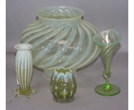 A vaseline glass lamp shade and three vases