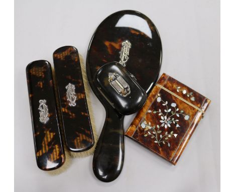 A tortoiseshell card case, a snuff box and a brush set