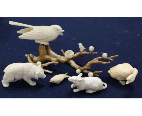 A carved ivory animal group