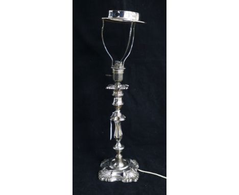 An Edwardian silver candlestick by William Hutton & Sons,now converted to a lamp, London, 1906, 30cm excluding fitting.