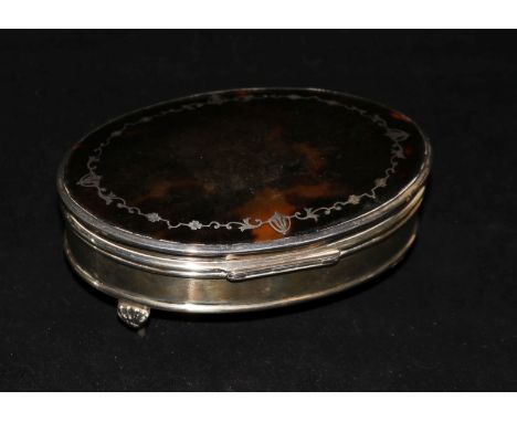 A George V silver mounted tortoiseshell oval trinket box by E.S. Barnsley & Co, Birmingham, 1921 (broken foot), 14.8cm.